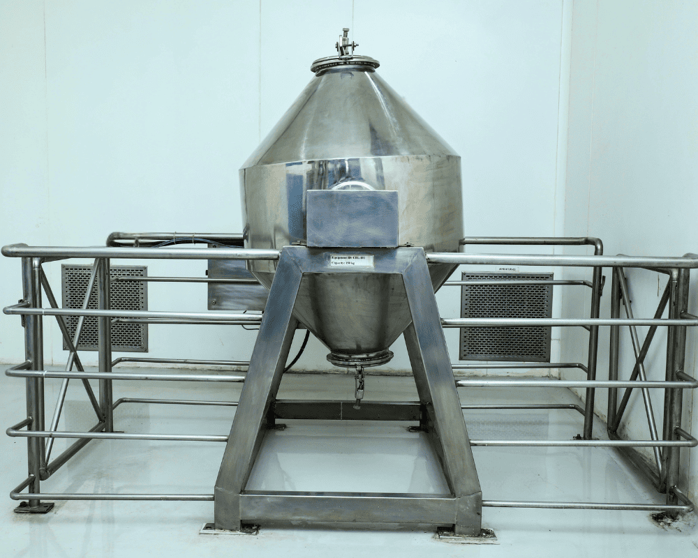 Industrial-grade double cone blender machine for uniform blending of dry powders and granules.