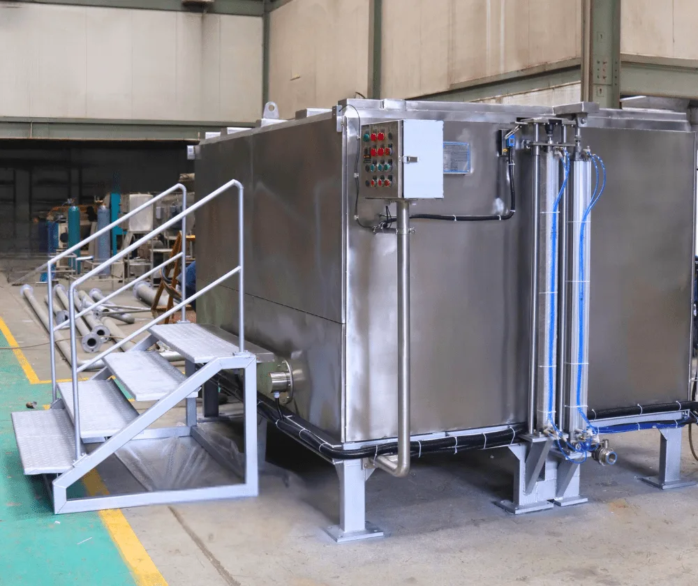 Large-scale automated quench tank with control panel, pipelines and stair access for industrial heat treatment processes